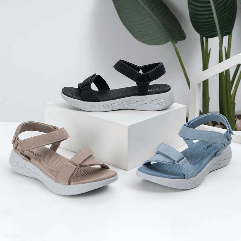 Three pairs of soft sole wedge open sandals for women in beige, black, and blue, featuring comfortable mesh uppers and durable rubber outsoles.